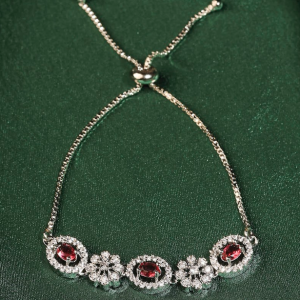 Adjustable Silver-Toned Bolo Bracelet with Oval-Cut Red Garnet or Imitation Stones