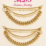 A two-layered drape design connected by structured gold-toned end-links