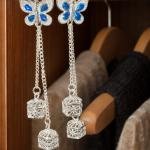 silver-toned butterfly threader earrings